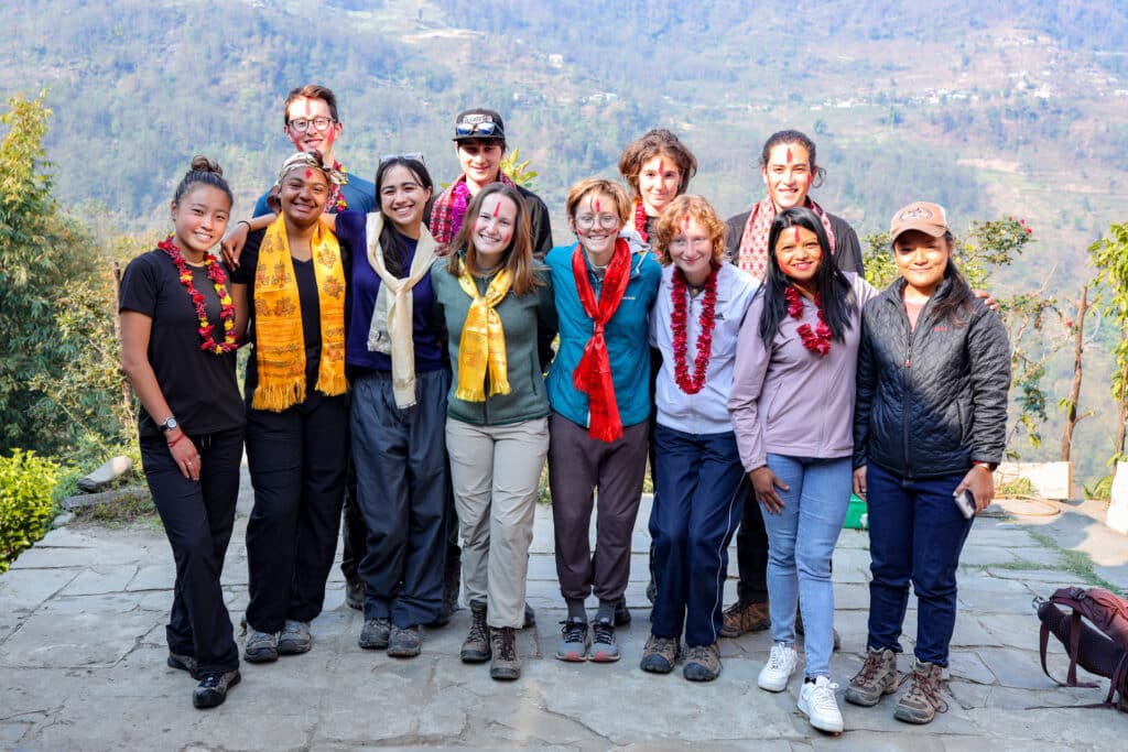 group with marigold necklaces