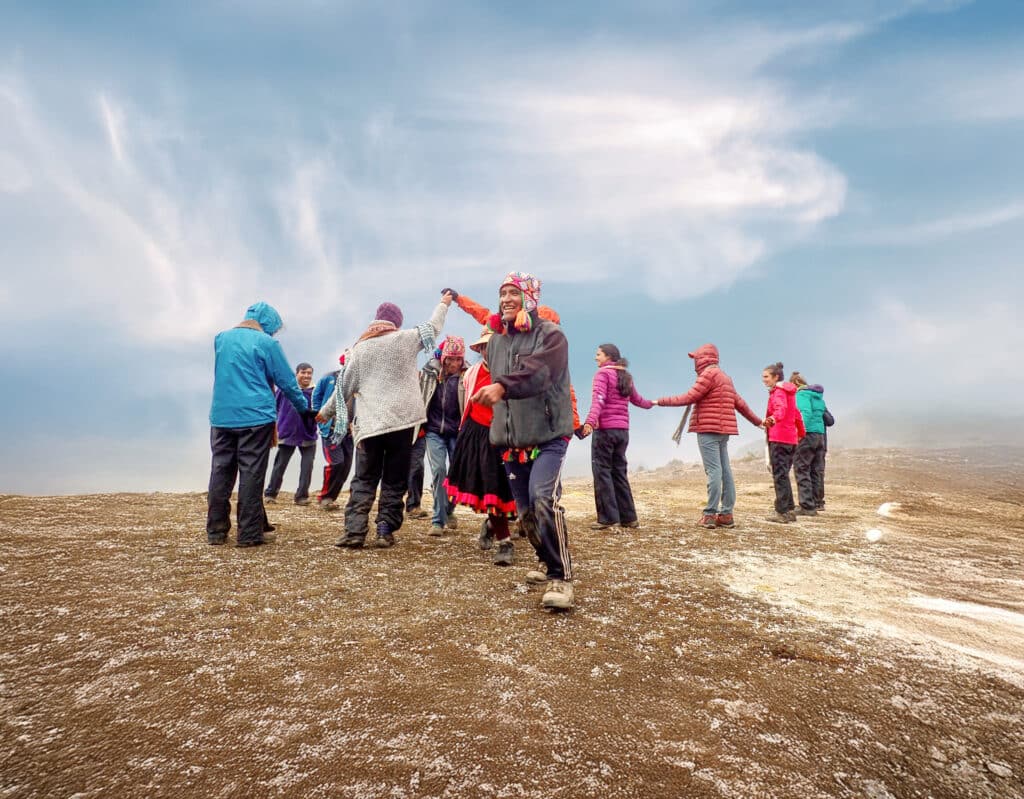 people celebrating in field