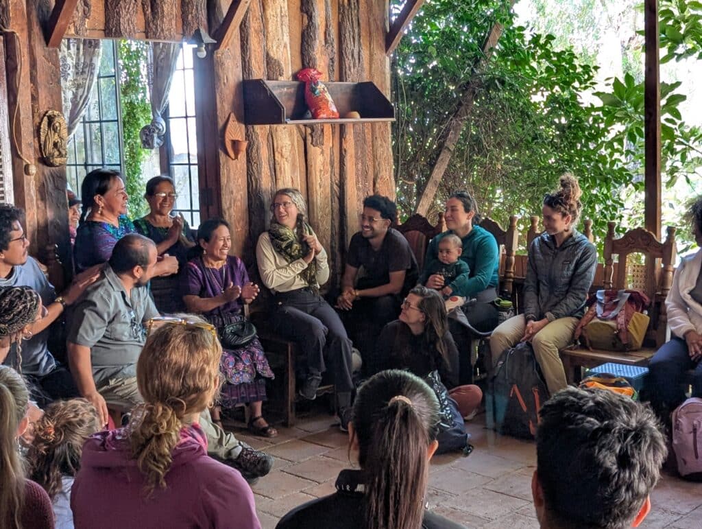 group sitting in circle laughing