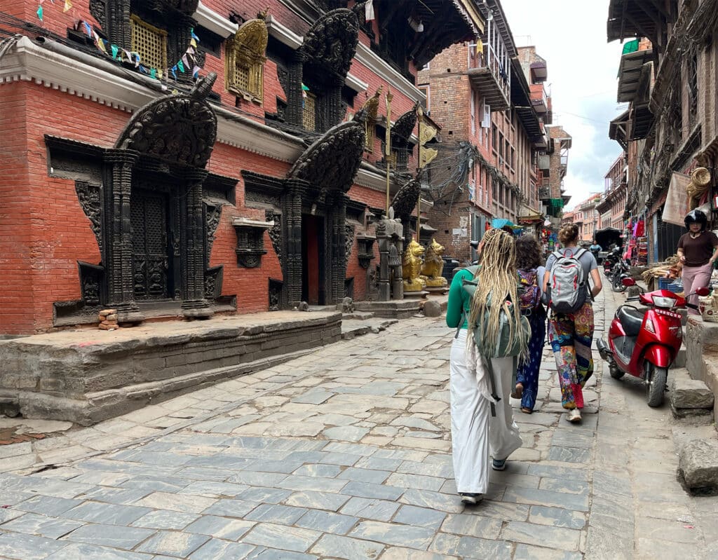 people walking down street in Nepal