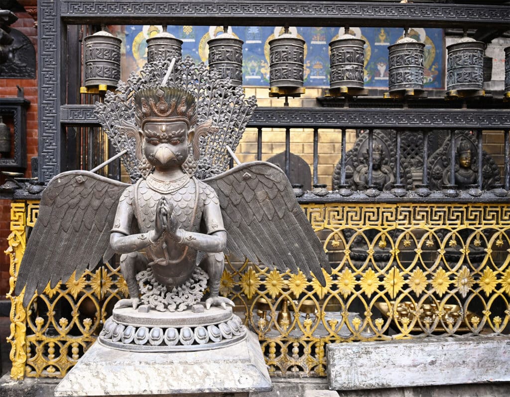 bronze carvings and prayer wheels